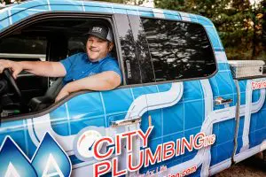 Man driving plumbing truck